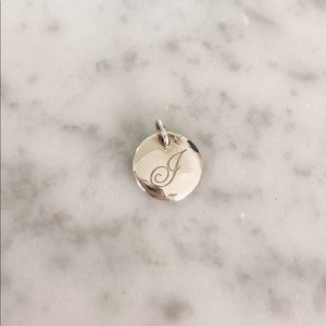 Tiffany & Co. Tiffany Notes Letter “J” Disc Charm.